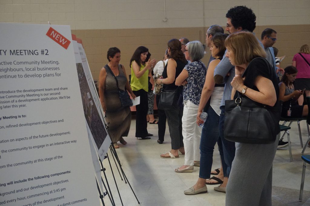 Community members viewing the presentation board display at the Second Community Meeting Held for Richview Square + 4620 Eglinton Ave. W.
